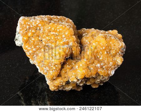 Macro Shooting Of Natural Mineral - Specimen Of Zeolite Stone On Black Granite From Rudniy, Kazakhst