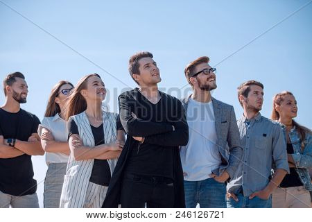 group of successful youth looking at a copy space