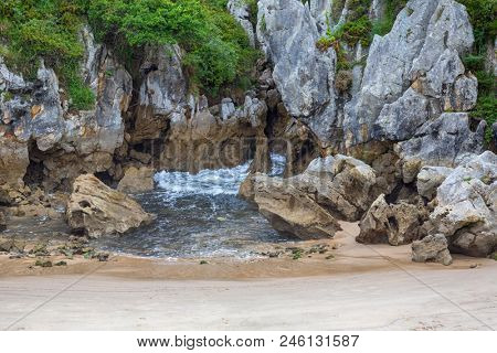 the famous beach gulpiyuri, in Asturias, Spain