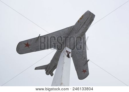 Evpatoria, Crimea, Russia - March 1, 2018: Monument In The Form Of A Mig-17 Jet Fighter Against The 