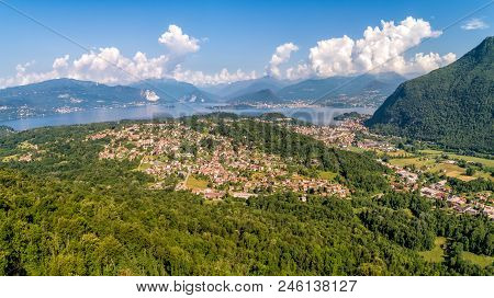 Panoramic View Of Lake Maggiore With Swiss Alps In Background In The Summer Day, Italy