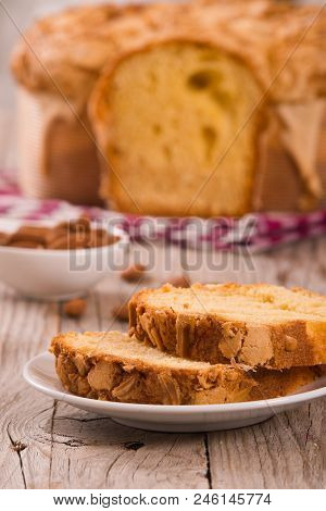 Easter Dove Bread Colomba Pasquale On Wooden Table.