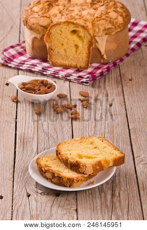 Easter Dove Bread Colomba Pasquale On Wooden Table.