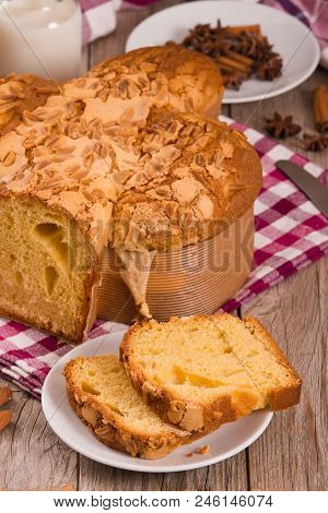 Easter Dove Bread Colomba Pasquale On Wooden Table.