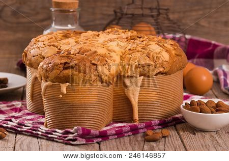 Easter Dove Bread Colomba Pasquale On Wooden Table.