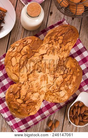 Easter Dove Bread Colomba Pasquale On Wooden Table.