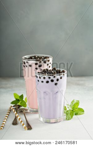 Taro And Strawberry Milk Bubble Tea With Ice In Tall Glasses