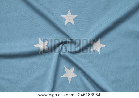 Micronesia Flag  Is Depicted On A Sports Cloth Fabric With Many Folds. Sport Team Waving Banner
