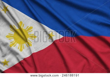 Philippines Flag  Is Depicted On A Sports Cloth Fabric With Many Folds. Sport Team Waving Banner