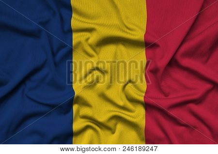 Chad Flag  Is Depicted On A Sports Cloth Fabric With Many Folds. Sport Team Waving Banner