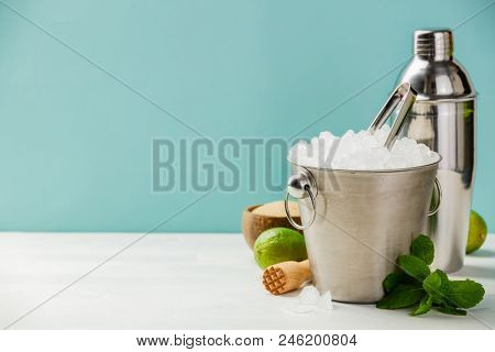 Metal ice bucket and mojito ingredients