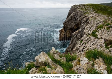 Coastal cliffs near of the beach Gulpiyuri, Asturias, Spain