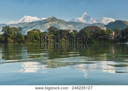 The Machapuchare and Annapurna range seen from Phewa Lake in Pokhara, Nepal