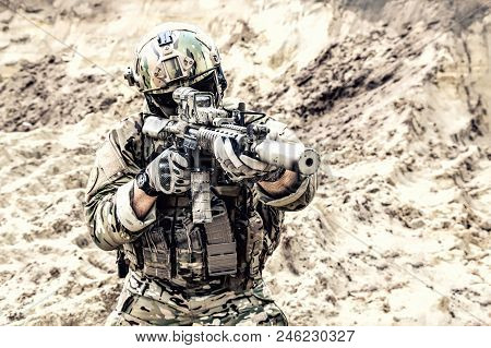 Special Operations Forces Fighter, Modern Infantry Soldier In Full Ammunition, Aiming With Red Dot S