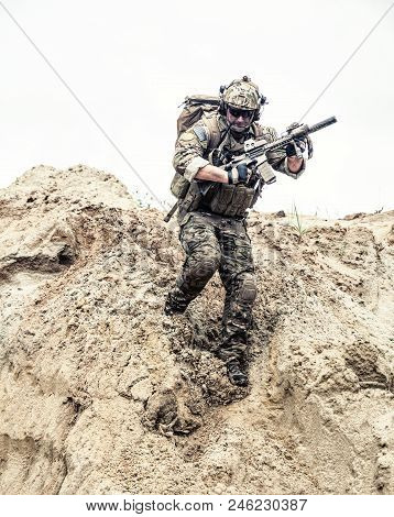 United States Army Commando, Special Forces Infantry Armed With Assault Rifle In Combat Uniform And 
