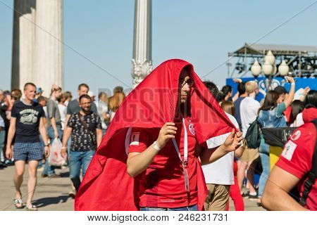 Football Fans Of The National Team Of Tunisia With National Flags And Attributes