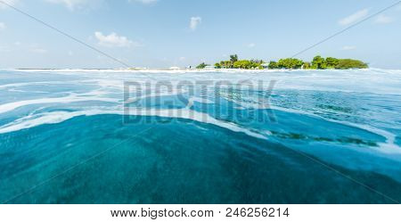 Tropical island and blue sea. View from low point