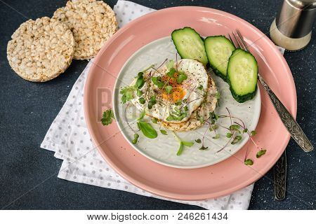 Breakfast Fried Egg, Micro Greens And Bread On A Pink Plate.