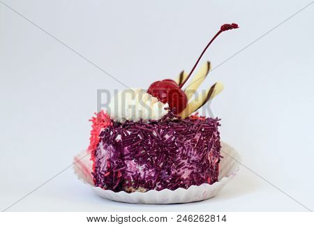 Colorful Cake Decorated With Cherries And Isolated On White Background