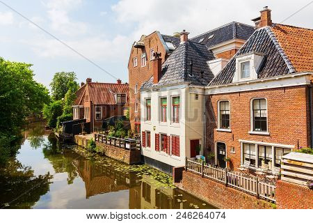 Canal With Old Buildings In Appingedam, Netherlands