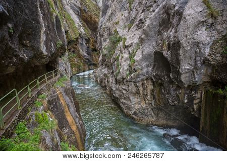 Entrance of the hiking trail Ruta del Cares along river Cares in Cain, Picos de Europa National Park, Leon, Spain. 