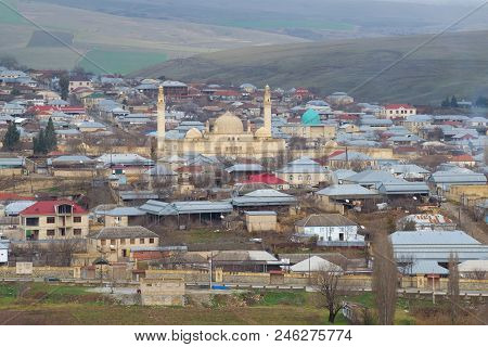 Shemakhi, Azerbaijan - January 03, 2018: Ancient Juma Mosque In The City Landscape On A Cloudy Janua