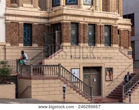 San Franciso, Ca -- January 23, 2016. A Homeless Man Sits On A Rail Outside A Church.