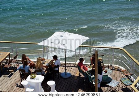Sitges, Spain - May 23: The Tourists Enjoiying Their Vacation In Outdoor Restaurant On May 23, 2015 