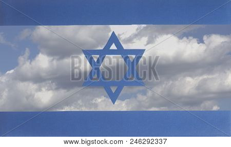 Flag Of Israel A Background Of Blue Sky And Clouds Closeup