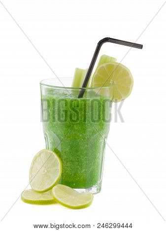 A Glass Of Green Smoothies With A Straw Is Made Of Such Ingredients As Lemons And Lettuce.