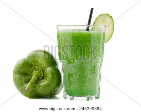 A Glass Of Green Smoothies Made Of Peppers And Limes Is Situated On The White Background.