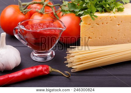 Tasty And Aromatic Tomatoes Parsley Chese Ketchup Garlic Hot Chili Peppers And Dry Pasta Are Served 
