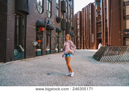 June 10, 2018. Tallinn, Estonia. Young Girl Exploring Tallinn City Including Old Town, Modern Distri
