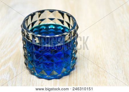 Glass With Blue Liquid On A Table