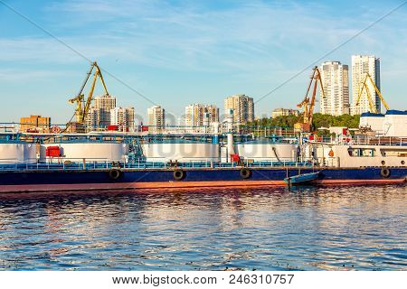 Barges And Cranes In The River Port