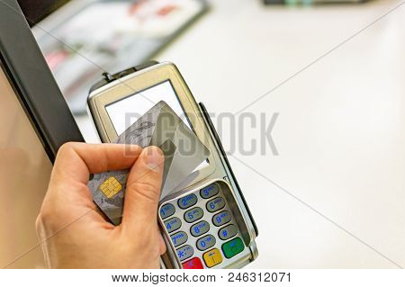 Male Paying With Nfc Technology On Credit Card, Hands Close Up. Man Using Credit Card For Pay By The