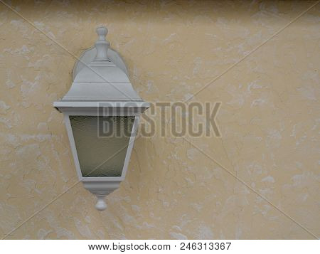 Rustic Light Is Off On Concrete Wall. Textured Background. Close Up.