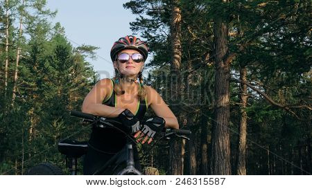 Fat Bike Also Called Fatbike Or Fat-tire Bike In Summer Riding In The Forest. Beautiful Girl And Her