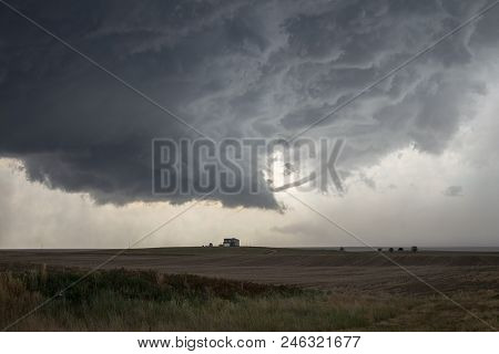 A Rope Tornado Funnel Dissipates Underneath The Updraft Of A Supercell Thunderstorm.