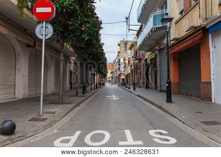 Street In Calella In Catalonia, Spain Near Barcelona. Scenic Old Town With Sand Beach And Clear Blue
