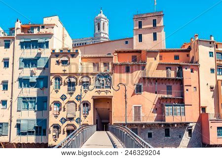 Colorful Red, Orange And Yellow Houses And Bridge Through River Onyar In Girona, Catalonia, Spain. S