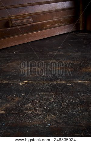 A Wooden Breadbasket On An Old Table