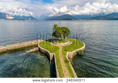 Landscape Of Lake Maggiore With Tree On The Pier, View From Cerro Of Laveno Beach, Province Of Vares