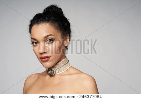 Beauty Closeup Portrait Of Beautiful Mixed Race Woman Wearing Chocker Looking At Camera, Isolated On