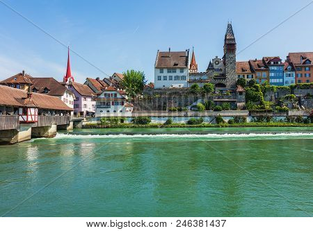 Buildings Of The Historic Part Of The Town Of Bremgarten Along The Reuss River. Bremgarten Is A Muni