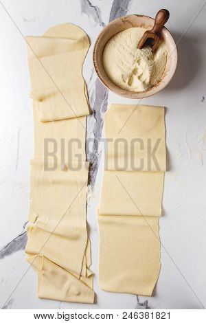 Rolled Dough For Homemade Italian Uncooked Pasta Lasagna From Pasta Machine Maker With Semolina Flou