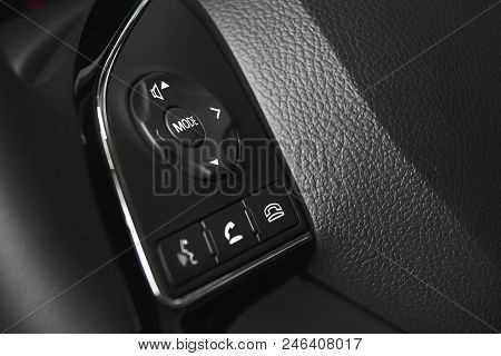 Multiple Controls Integrated In The Wheel Car. Modern Car Interior, Gray Steering Wheel With Media P