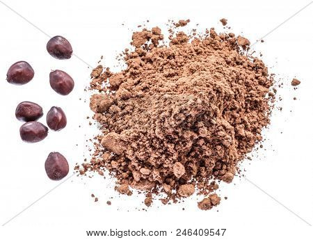 Carob beans and carob powder on the white background.