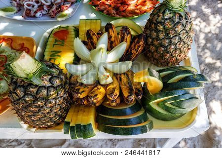 Fresh Tropical Fruits On The Beach. Fresh Tropical Fruits On The Table. The Concept Of Relaxation. H