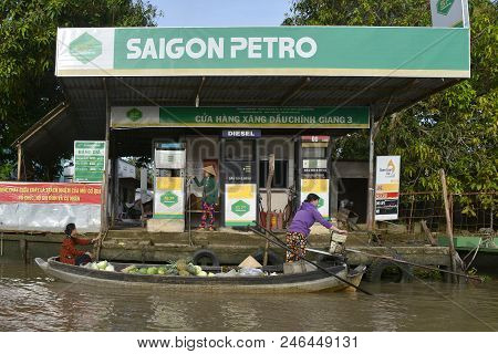 Phong Dien, Vietnam - December 31st 2017. A Market Boat Stops To Refuel On The River At The Phong Di